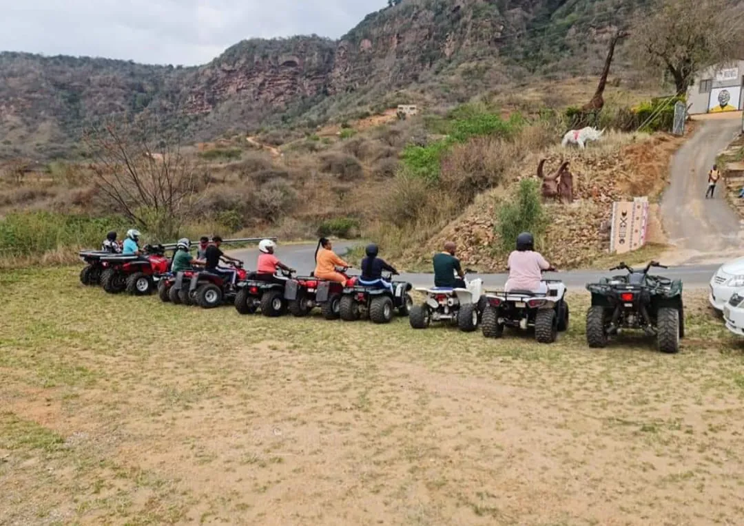 A group of riders lined up on their quads ready to set off